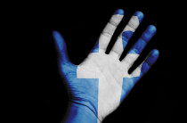 Ruka s logem sociální síti Facebook. Ilustrační foto - 42TČen